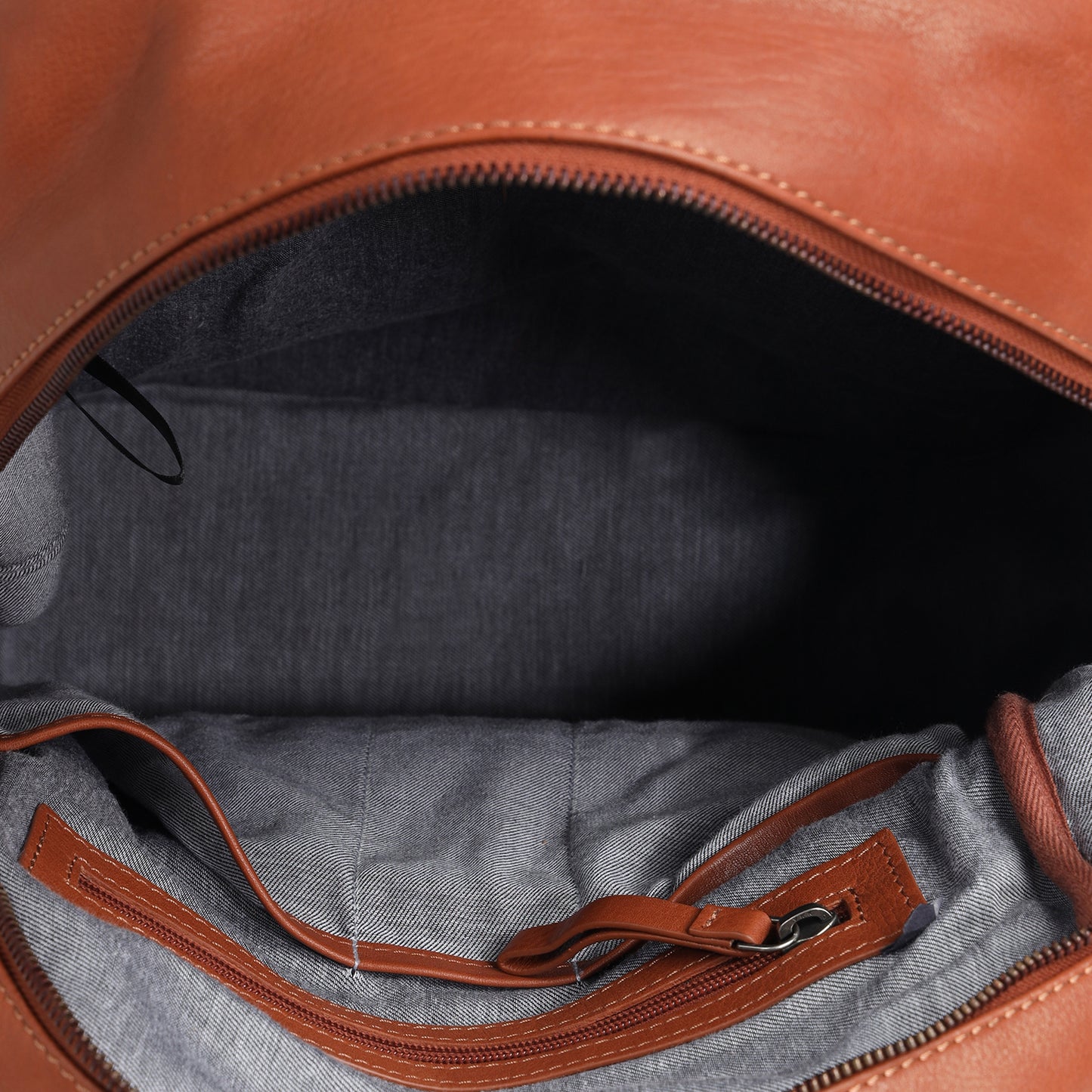 TL LEATHER BACKPACK WITH FRONT AND SIDE POCKET